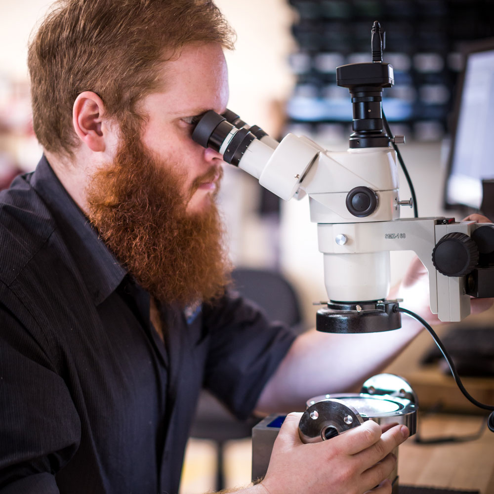 researcher with microscope