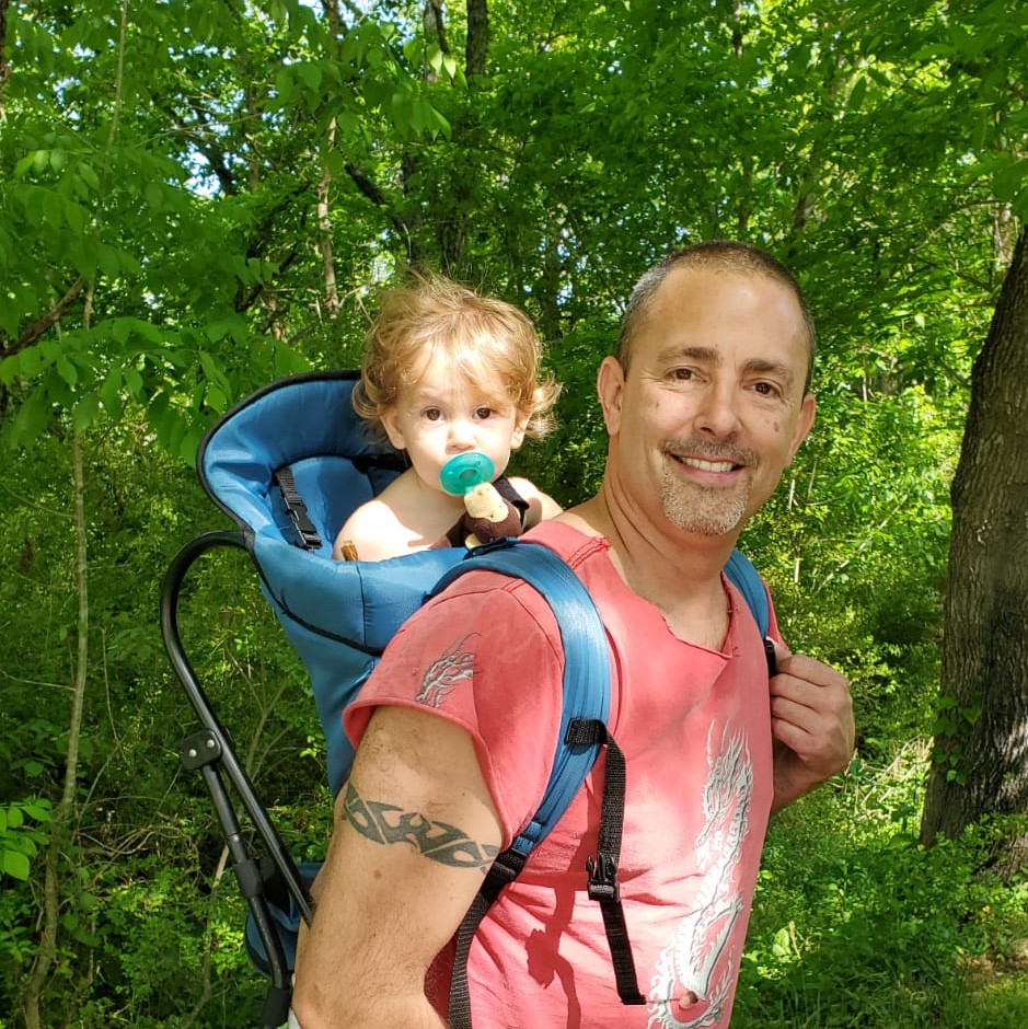 Jason Kelley exploring the outdoors with his daughter