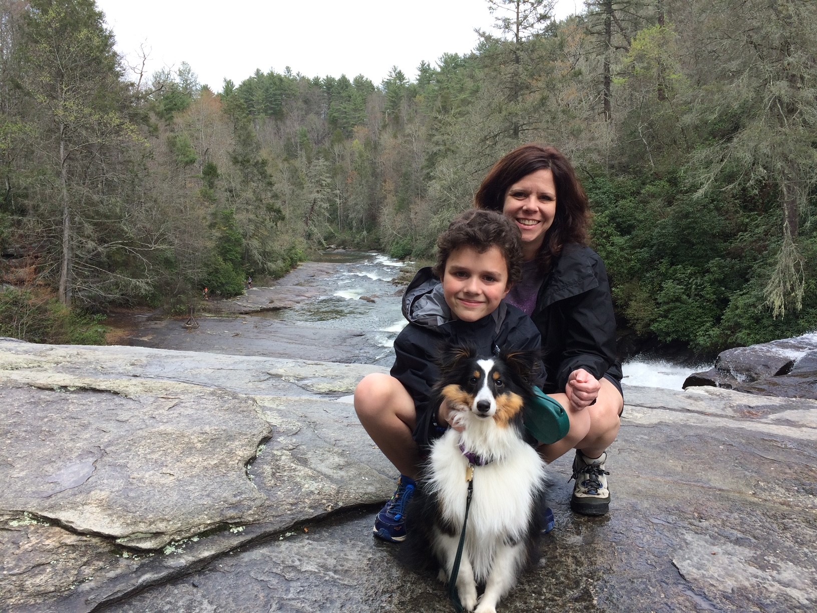 Susan Campbell and her son in a WNC river