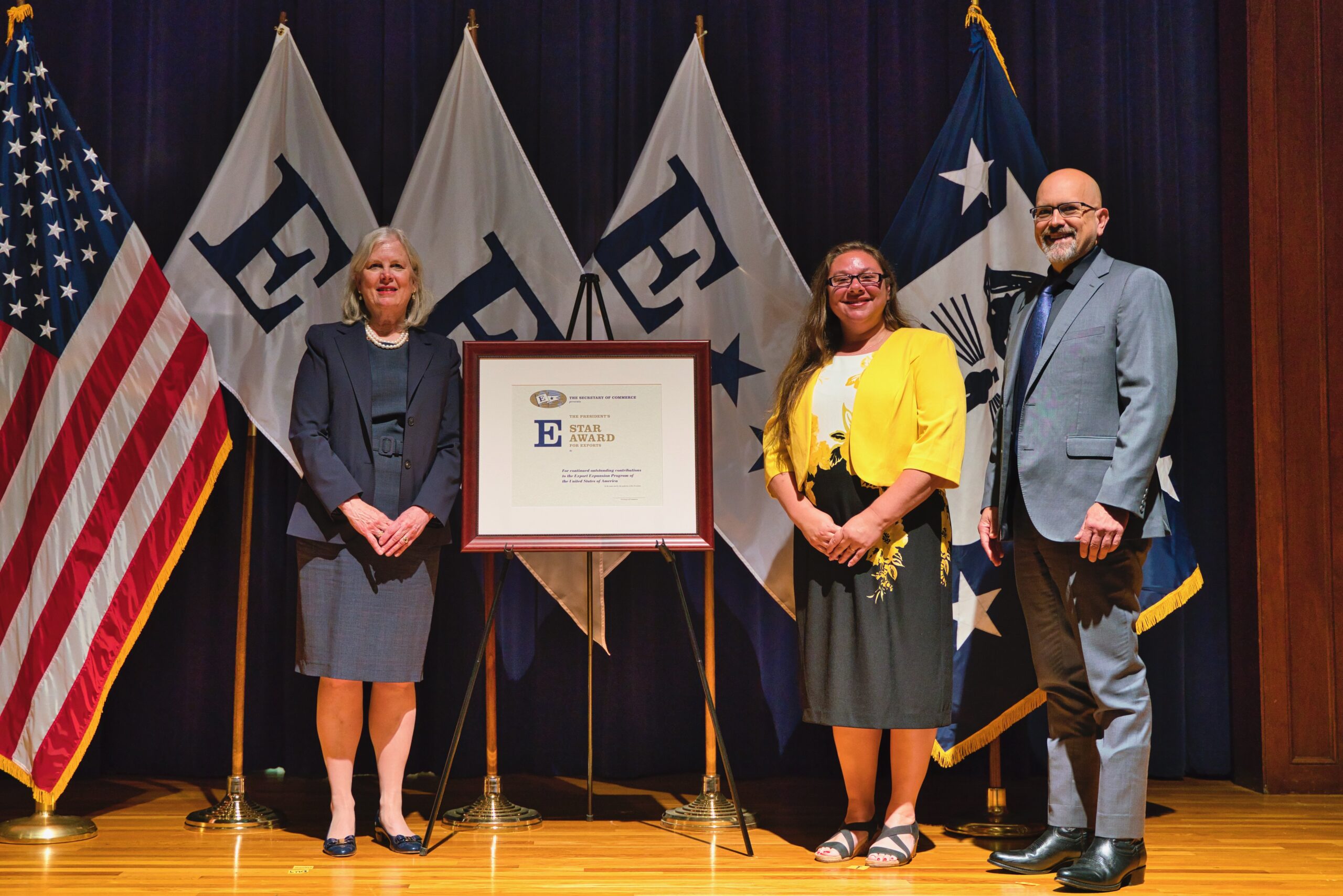 David Reed and Julie Detmering with undersecretary of commerce and e star award