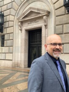 David Reed in front of Department of Commerce