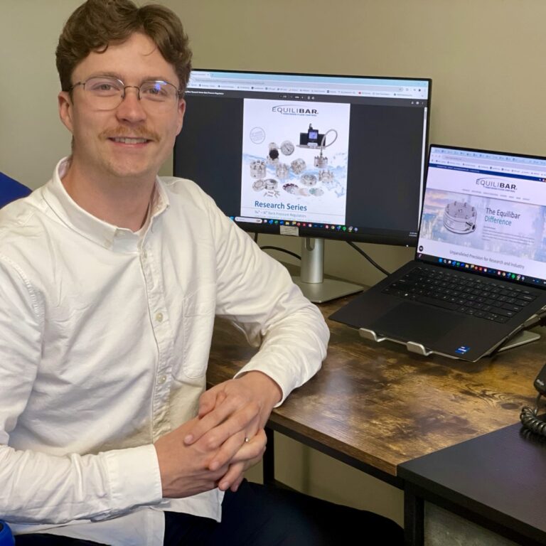 Connor Kerlin, application engineer, at desk